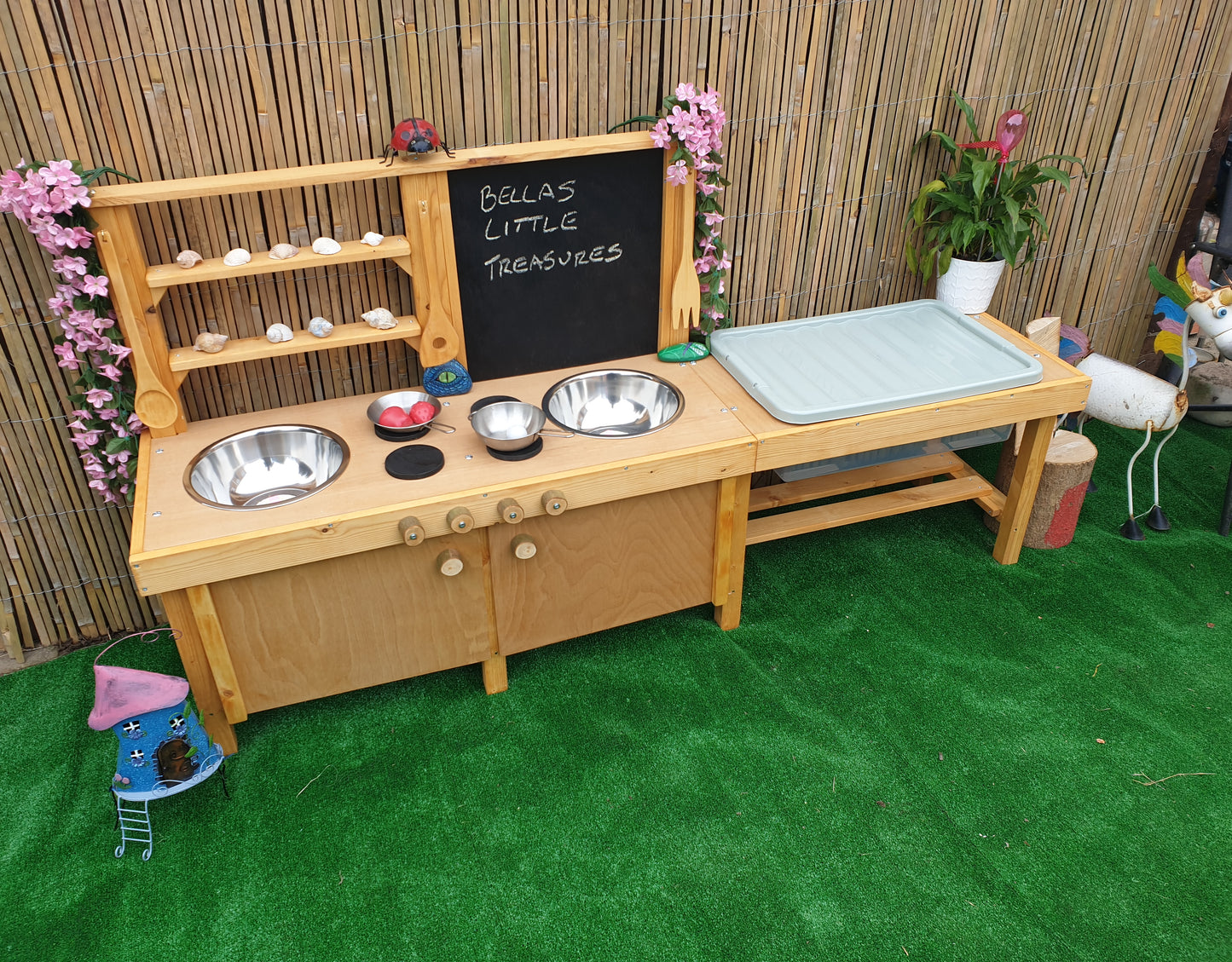 Large mud kitchen with blackboard and water / sand table