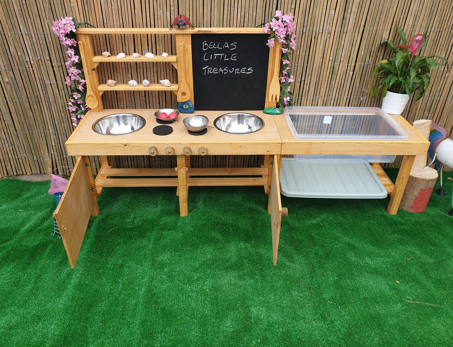 Large mud kitchen with blackboard and water / sand table