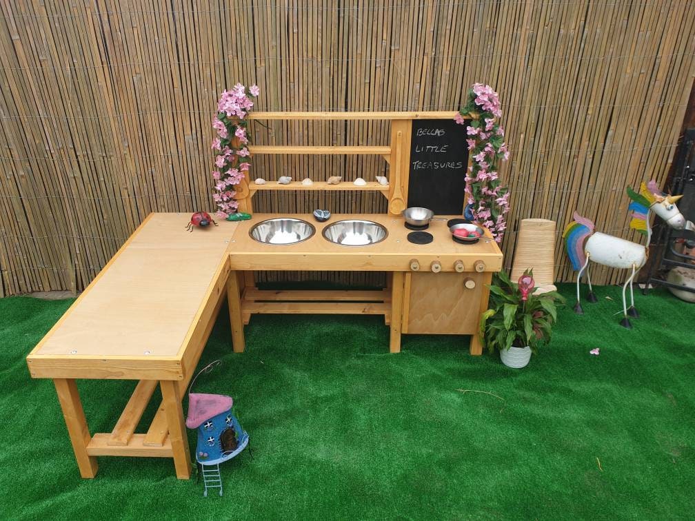 L shape mud kitchen with oven, blackboard and large worktop